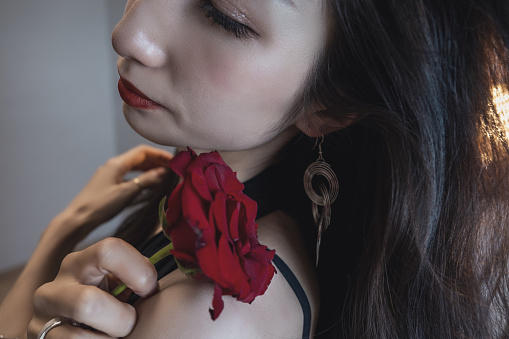 Beautiful, stylish women and a rose