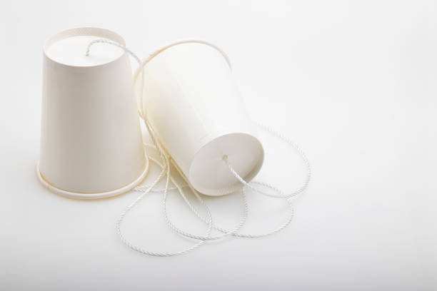 istock Kid telephone made from paper cups , children's experiments on communication 1347808045