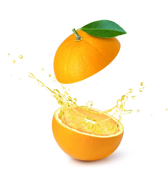 istock Orange essential oil splashing isolated on white background. 1347810785
