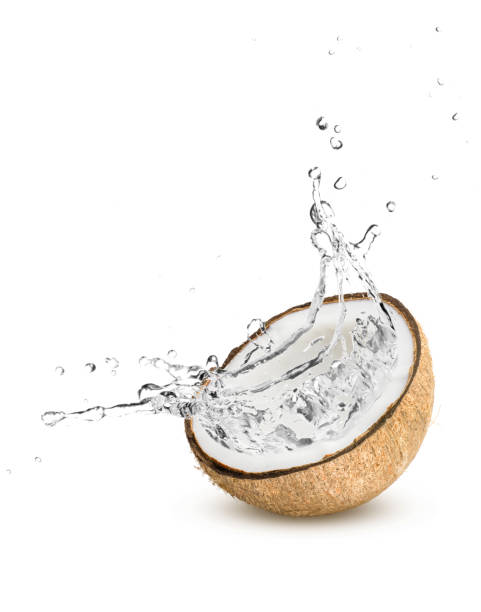coconut water splash on white background. - drink close up dairy product flowing imagens e fotografias de stock