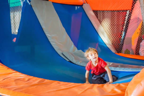 istock Little boy have fun jumping on trampolines 1347812914