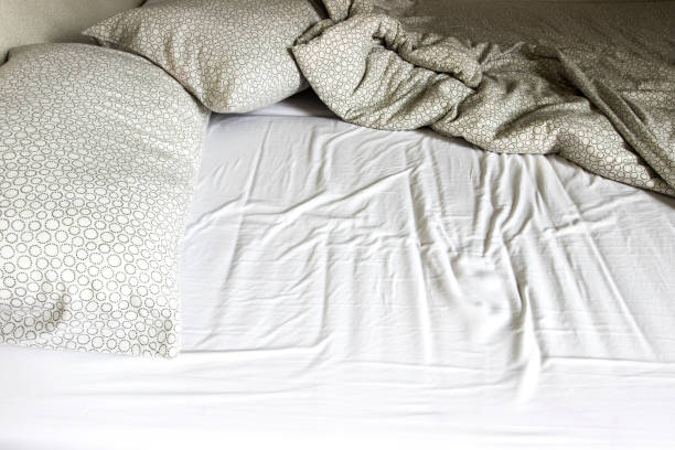 istock Mattress, blanket and pillows after waking up. 1347817020
