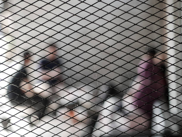 blur of people talking in a coffee shop. with mesh foreground