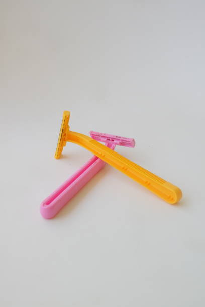istock used pink beard razor on white isolated background photo 1347825646