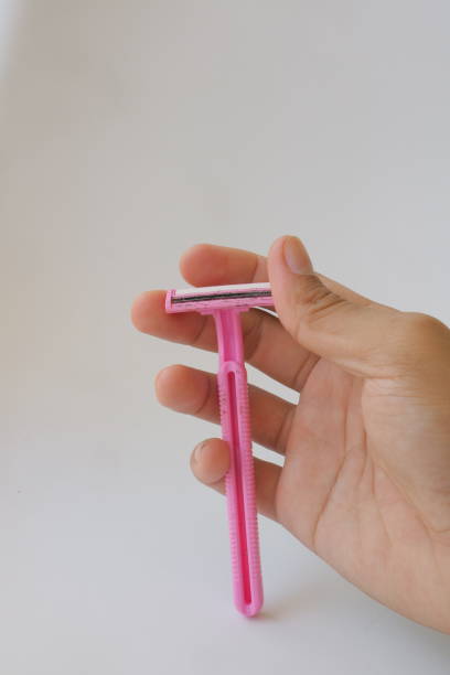 istock used pink beard razor on white isolated background photo 1347825651