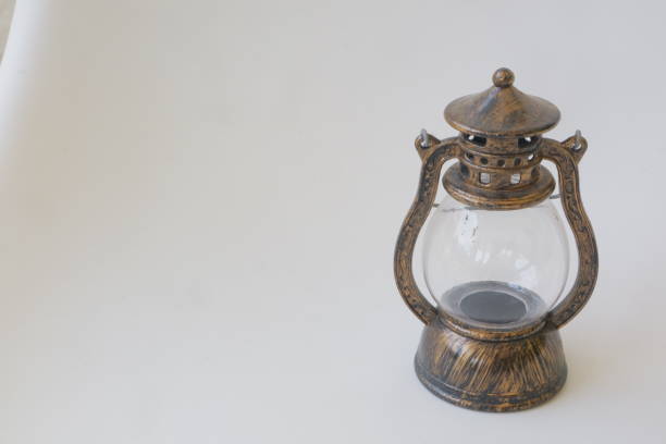istock Miniature brown lantern on white isolated background photo 1347826478