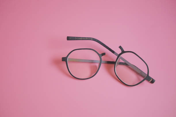 istock Broken glasses on the pink background 1347826958