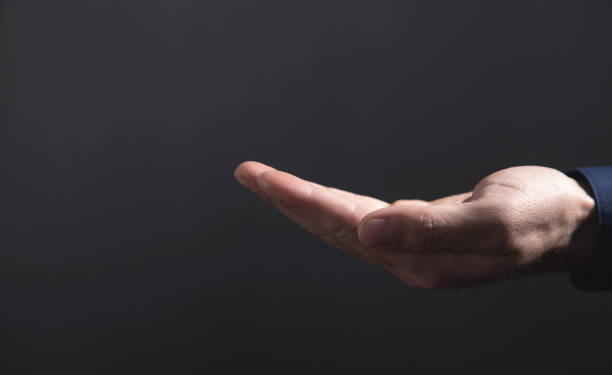 istock Caucasian businessman showing empty hand. 1347829002