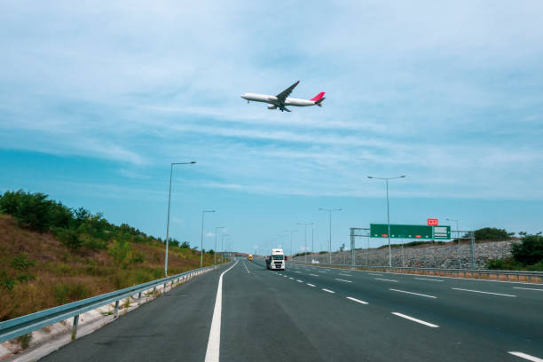 istock Plane flying over the city highway 1347832385