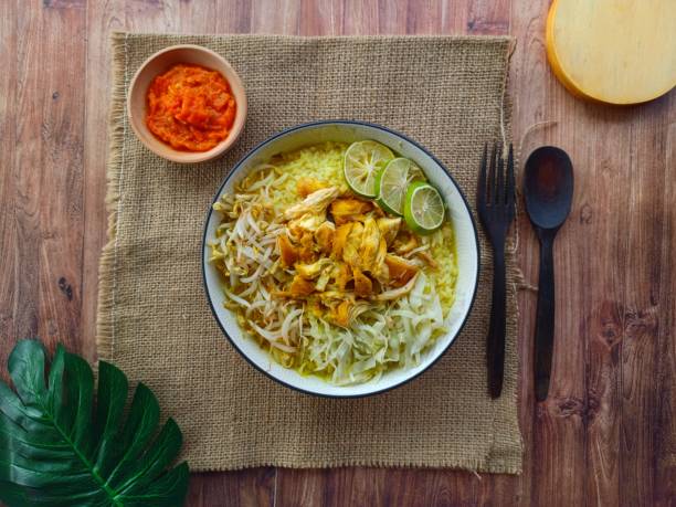 istock Chicken soup with rice, bean sprouts and cabbage and chili sauce 1347832656