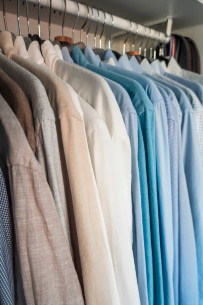 istock Pressed dress shirts hanging in a closet. 1347834734