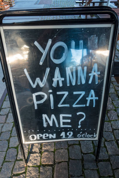 istock A sign for Pizza on the sidewalk. 1347834736