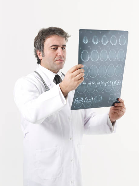 istock Doctor looks at brain scan images 1347834900