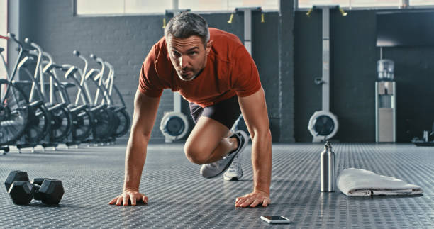 istock Shot of a mature man doing mountain climbers during his workout 1347836433