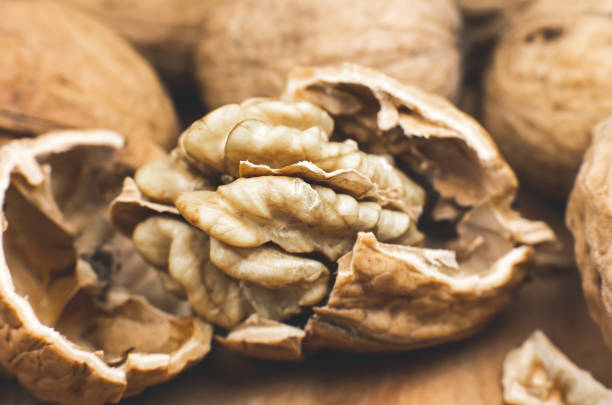 istock Crushed Walnut on the wood background. Close up. 1347837620