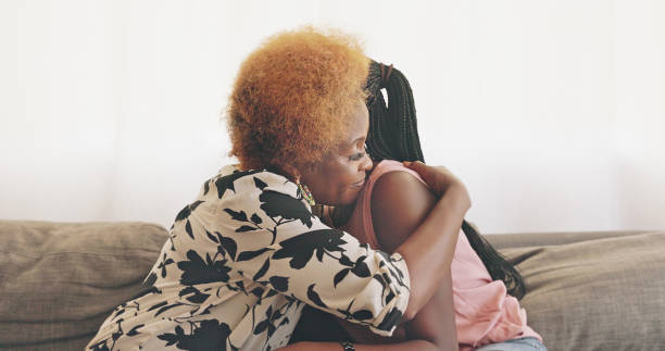 Shot of a mother and daughter consoling each other at home Mother was comfort. Mother was home empathy stock pictures, royalty-free photos & images