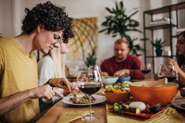 istock Group of friends dining together 1347840116