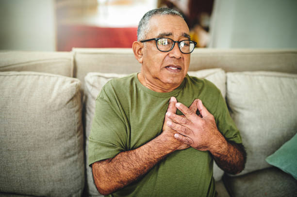 Shot of a senior man holding his chest in pain Could this be a heart attack heart disease photos stock pictures, royalty-free photos & images