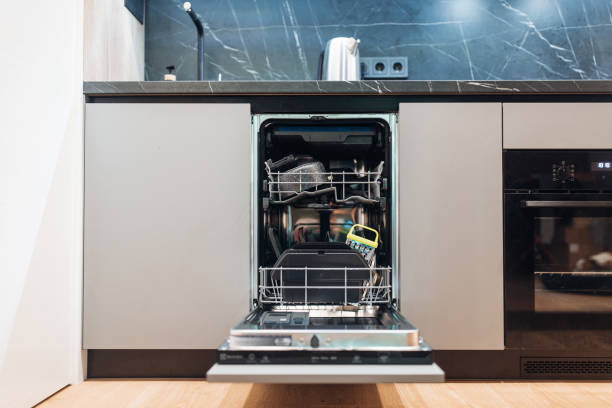 istock Open dishwasher with clean dishes in the evening 1347845867
