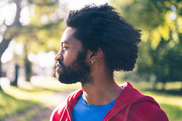 istock Profile view of bearded athlete outdoors in autumn sunshine 1347849711