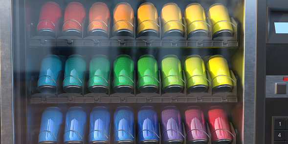 A close up of a vending machine showing three stacked rows of soda drinks cans in shades of rainbow colours.