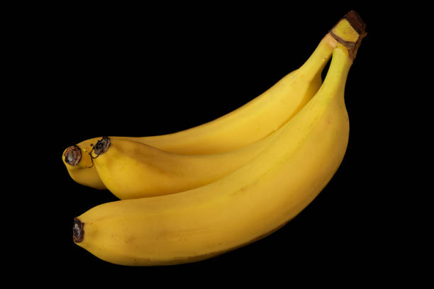 istock banana lies on a black background 1347852005