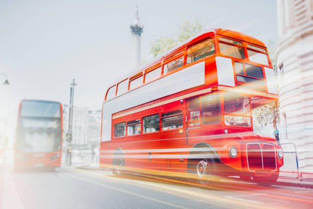 istock London Red Buses New and Old in motion with light rails 1347854633