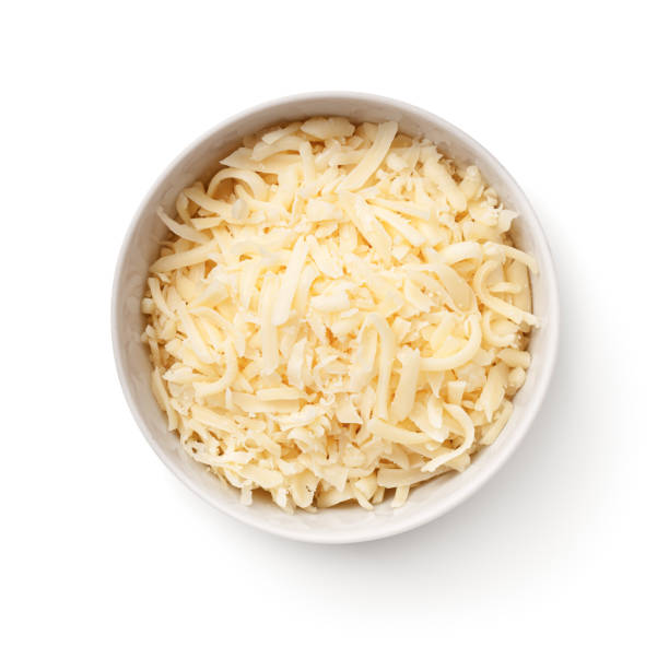 formaggio gouda grattugiato in ciotola bianca isolata - food and drink cheese grated bowl foto e immagini stock