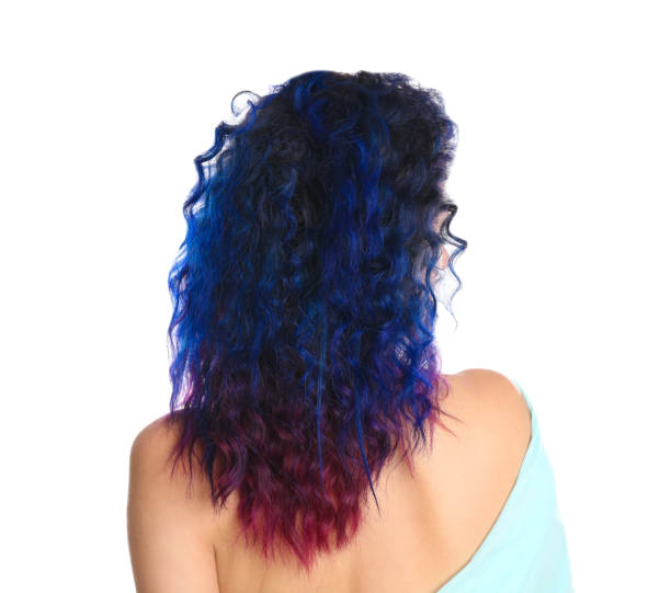 istock Young woman with bright dyed hair on white background, back view 1347854651