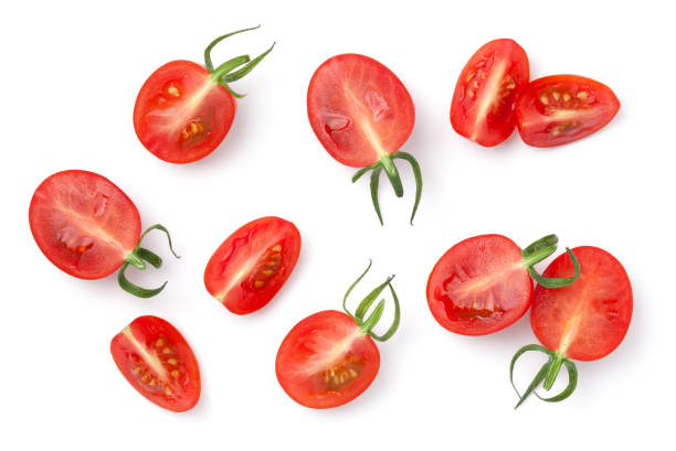 tomates cherry cortados aislados sobre fondo blanco - cherry tomato fotografías e imágenes de stock