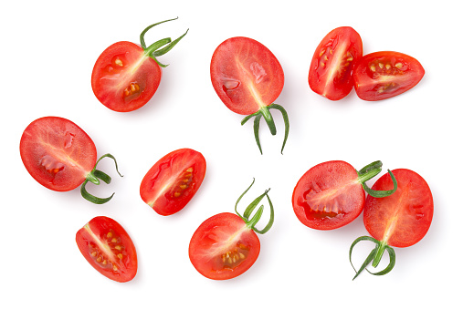 Cherry tomatoes isolated on white background. Cut in half and quarter. Top view