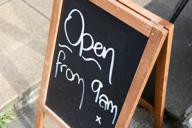 istock A-board sign on the sidewalk indicating opening hours 1347858185