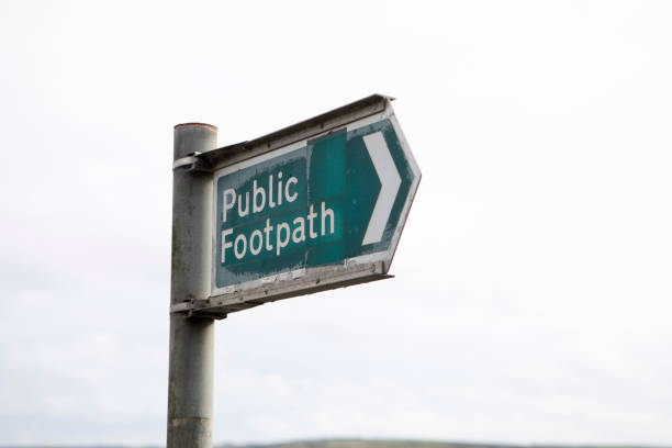 istock Public footpath sign against  clear sky 1347858219