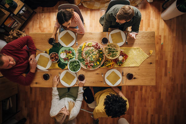 istock Group of friends dining together 1347859126