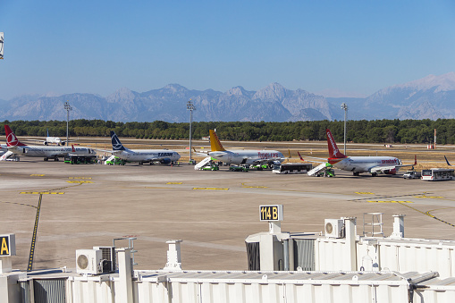 Turkey, Antalya, 03.09.2021: parked planes at Antalya international airport, passenger planes of Pegasus, orendon, Taron and Turkish Airlines