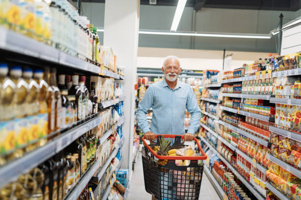 istock Retired man buying groceries 1347862207
