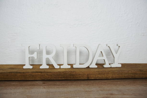 istock Friday alphabet letters on wooden background 1347862551