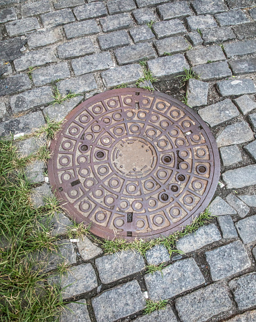 sewer manhole in the center of Freiburg Germany
