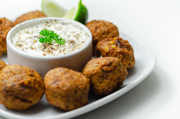 Falafels, gently spiced blend of sweet potato, chickpeas and onion with a sour dip,