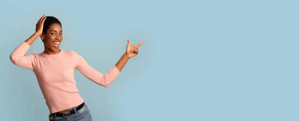 istock Amazing Offer. Excited Black Female Touching Head And Pointing Aside 1347867368