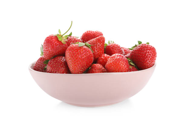 istock Ripe strawberries in bowl isolated on white 1347868633