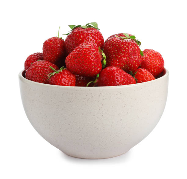istock Ripe strawberries in bowl isolated on white 1347868634