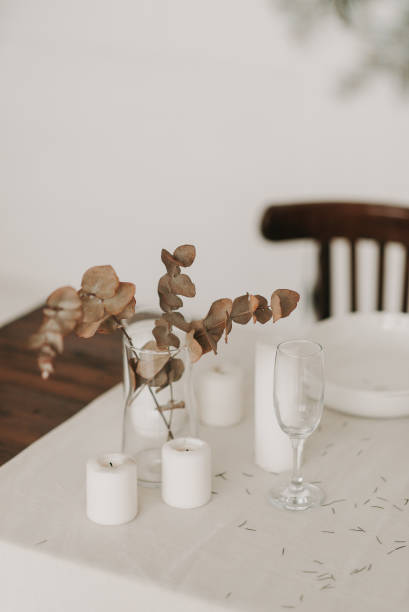 istock artificial flower close-up in a vase on a table with a white tablecloth 1347868833