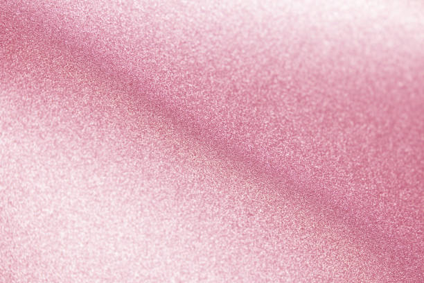 istock pink color glitter paper abstract, defocused texture, blurred shiny background, new year photography 1347869129