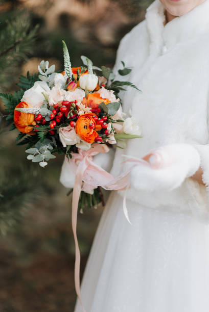 istock bride in a white fur coat holds a bright colorful bouquet in her hands 1347870187