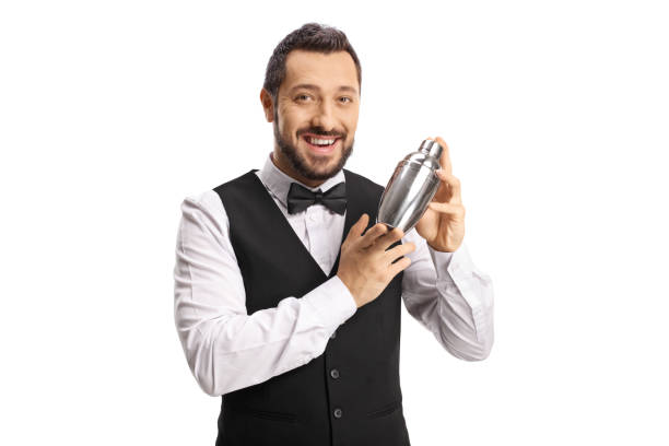 istock Barman mixing a cocktail shaker and smiling 1347870335