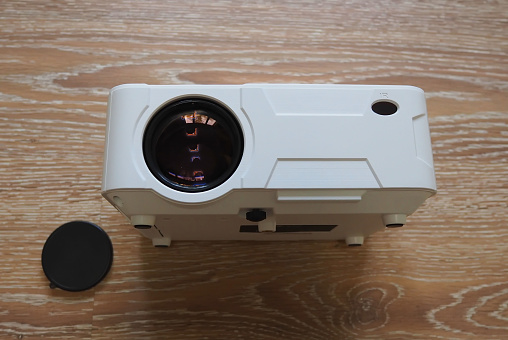 A projector for watching movies. A home or office projector for watching movies.