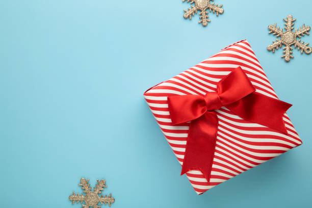 istock Christmas gift and decoration on blue background. 1347870442