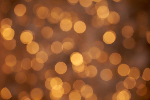istock defocused christmas glossy background textured orange 1347870680