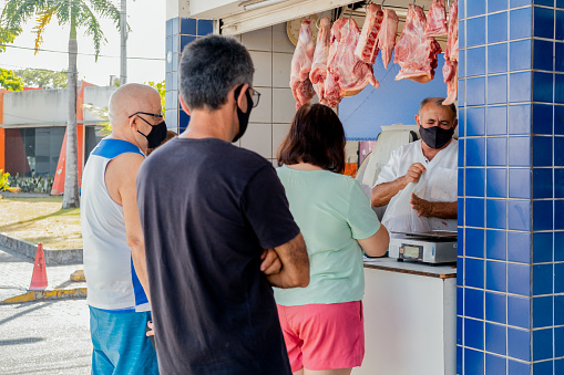 Joao Pessoa, Paraíba, Brazil - October 16, 2021:People buying and selling food in a public market from Tambaú district.